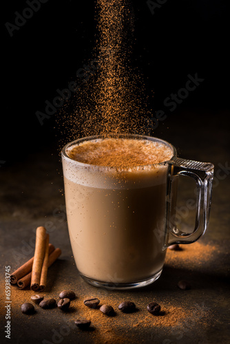 in the foreground, a glass with coffee and a vegetable drink flavored with ground cinnamon