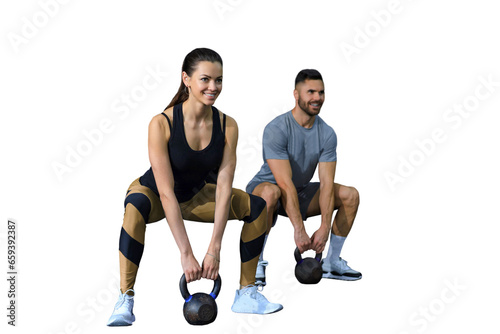 Fit and muscular couple focused on lifting a dumbbell during an exercise class on a transparent background