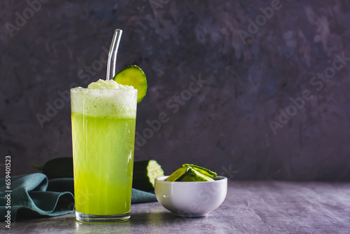 Fresh cucumber lemonade in a glass on the table