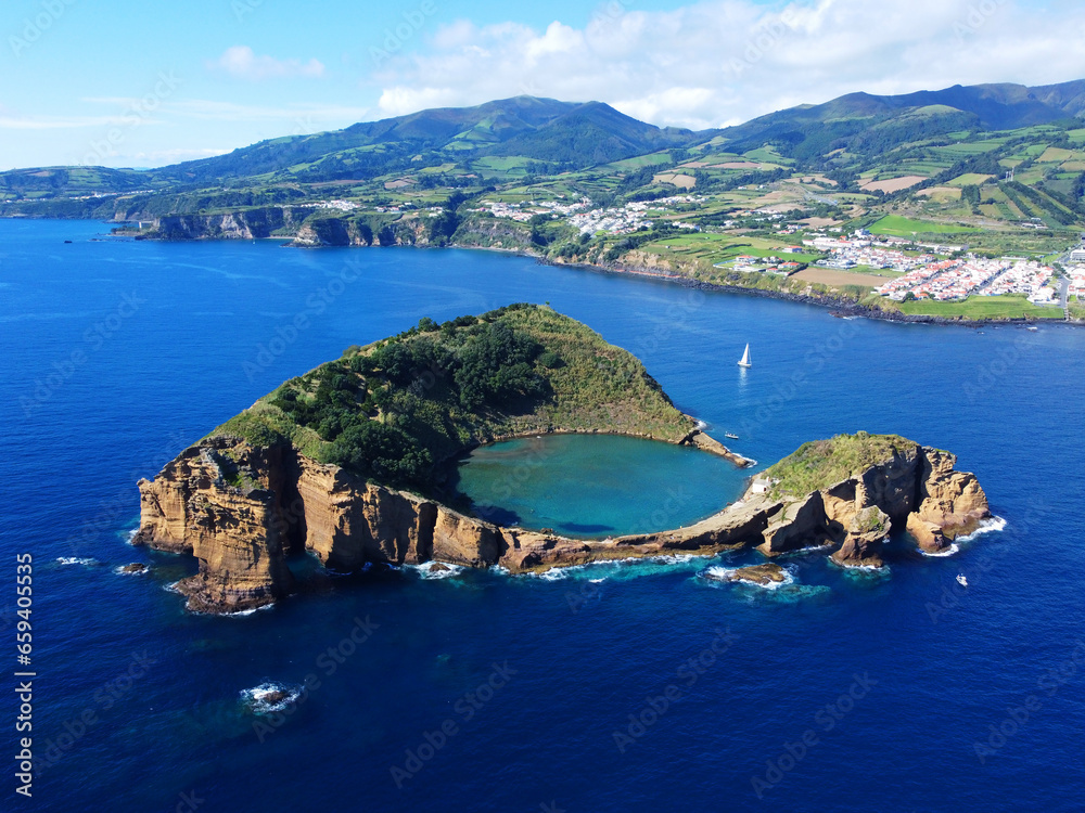Fototapeta premium Azores aerial panoranic top view of Islet of Vila Franca do Campo. Crater of old volcano in ocean. San Miguel, Acores, Portugal. Travel concept.
