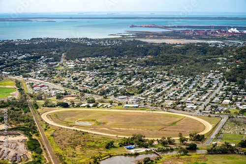 Aerial view of Gladstone race course with residential area and industry in the background