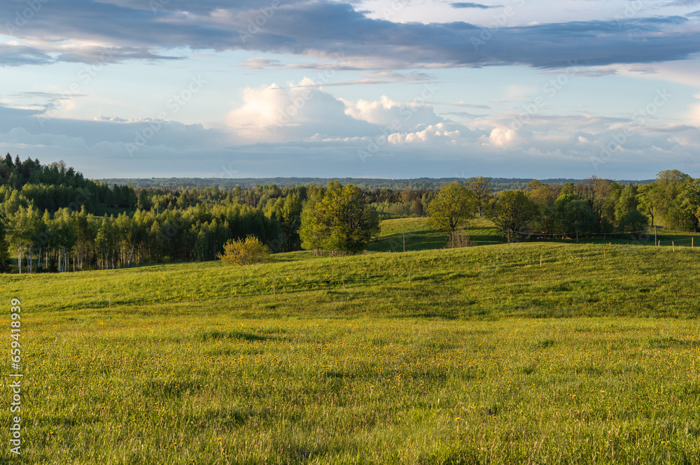 Agricultural fields and forests on the hills in the evening light