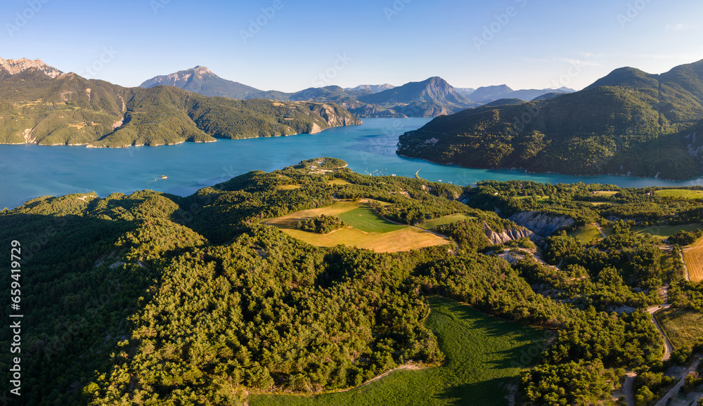 Aerial view of Serre-Poncon lake with Chanteloube Bay. Summer in Durance Valley. Hautes-Alpes (Alps), France