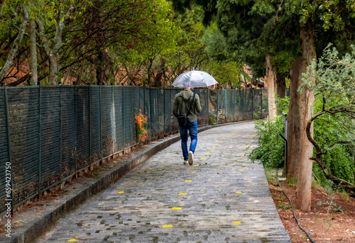 Man walking with umbrella
