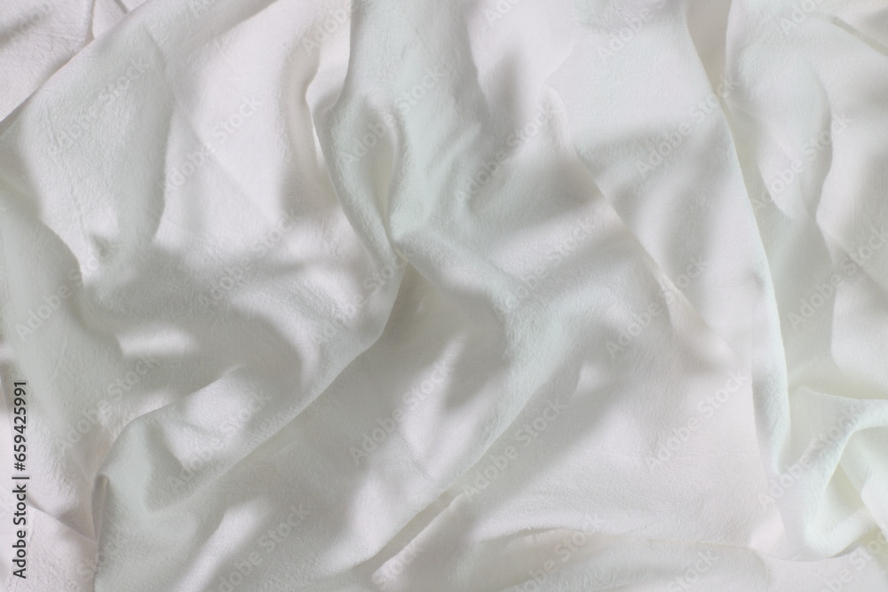White bedding sheet with messy shadows