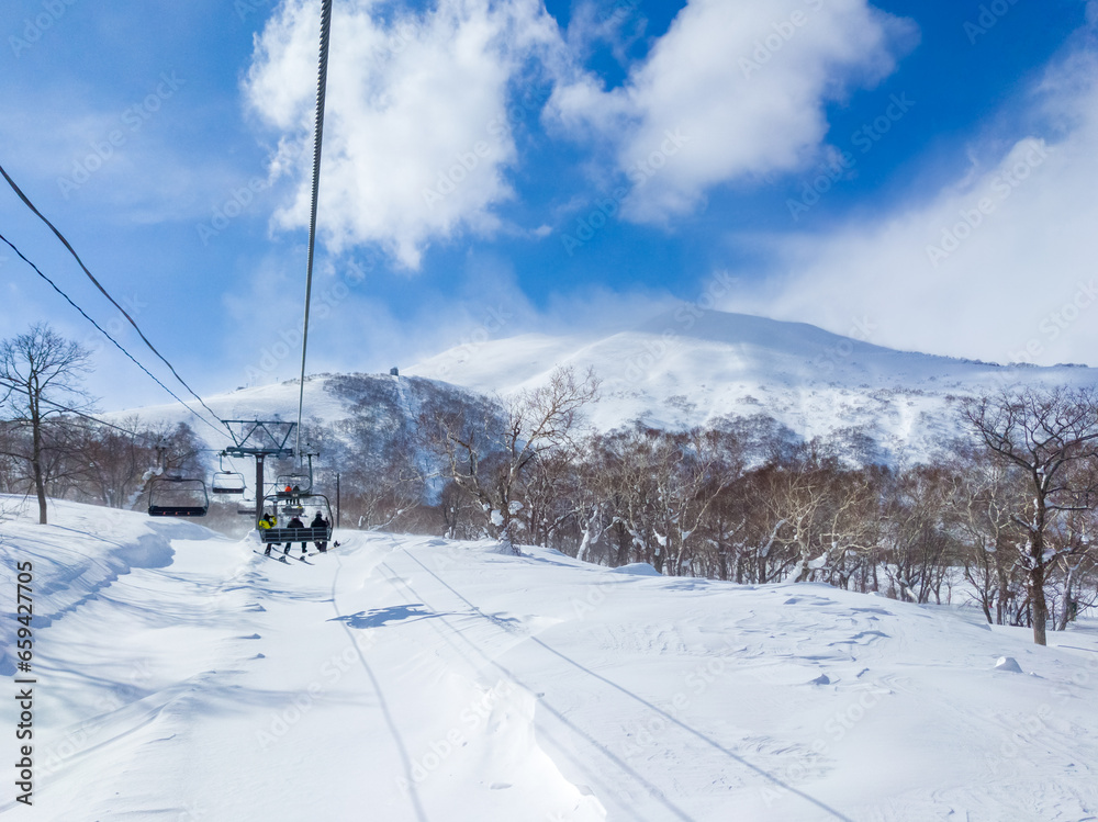 View of the ski resort summit from a chairlift (Niseko, Hokkaido, Japan)