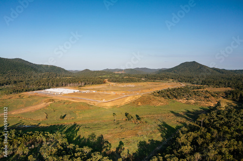 View of Aldoga hydrogen park near Gladstone, Queensland, with auxite red mud dam in background