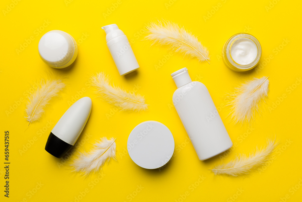 Spa cosmetic product, cream jar, branding mock up, top view with feathers background. Flat lay