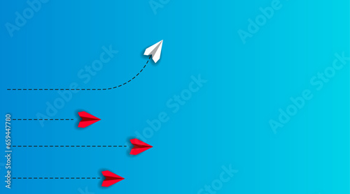 paper airplane flying in different direction on blue background.
Business concept for new idea, creativity, innovation and solution.