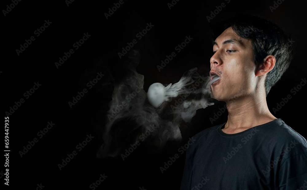 Man making smoke ring with vapor Man making smoke ring with vapor