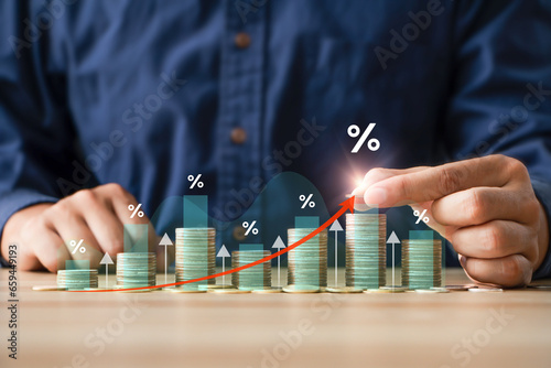 Interest rate and dividend concept. Businessman with percentage symbol and up arrow for financial banking increase interest rate or mortgage investment dividend from business growth.