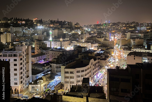 Scenic view of illuminated Amman, Jordan at night