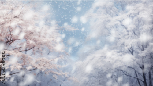 Christmas or new year light blue snowy background. Holiday glowing backdrop with falling snow and blurred bokeh. Defocused winter background with snow fall and copy space. Magic forest