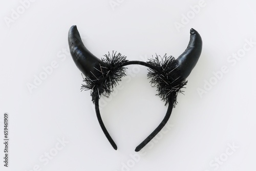 Black horns of the devil in the form of a hoop