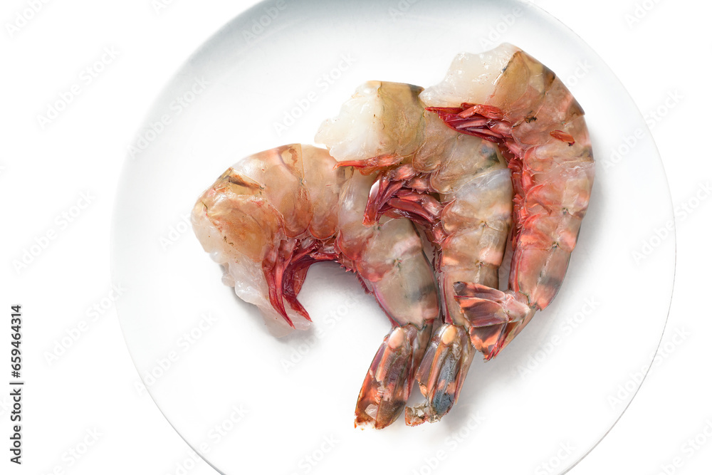 Three raw large tiger prawns without head and cleaned for cooking on a white plate, top view from above, copy space Three raw large tiger prawns without head and cleaned for cooking on a white plate, top view from above, copy space