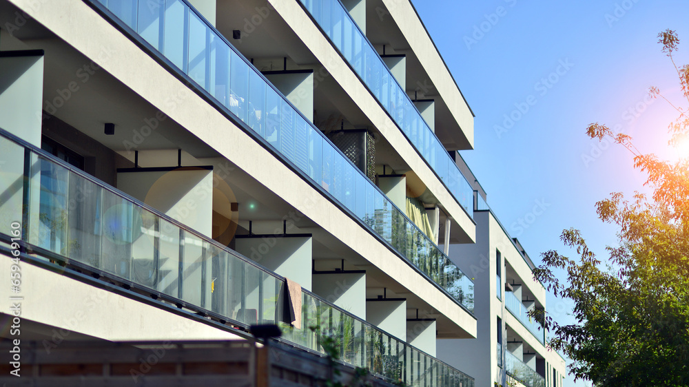 Fototapeta premium Brand new apartment building on sunny day. Modern residential architecture. Modern multi-family apartment house. 