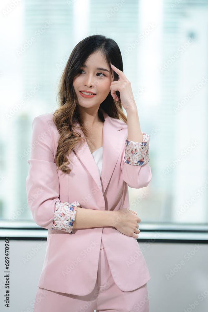 Happy confident smiling young professional Asian business woman corporate leader, Japanese female employee or company sales marketing manager standing arms crossed in office, cute girl portrait Happy confident smiling young professional Asian business woman corporate leader, Japanese female employee or company sales marketing manager standing arms crossed in office, cute girl portrait