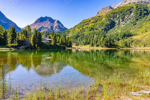 A view of the Cavlocc lake, in Engadine, Switzerland, and the mountains that surround it. 