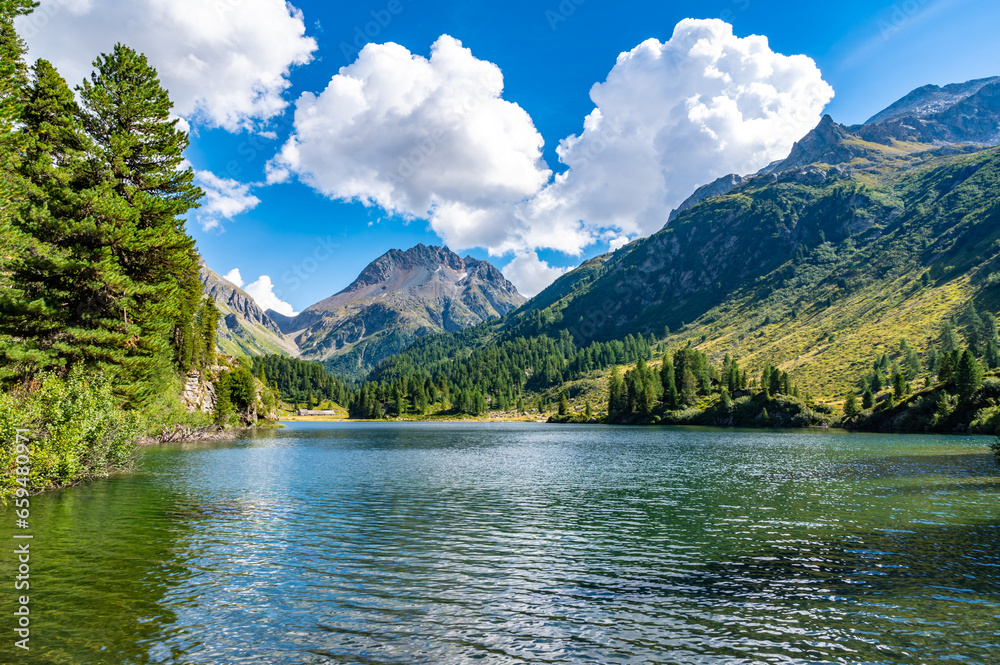 A view of the Cavlocc lake, in Engadine, Switzerland, and the mountains that surround it.
