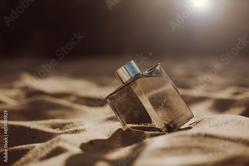 Fototapeta Naklejka Na Ścianę i Meble -  bottle of perfume on the beach