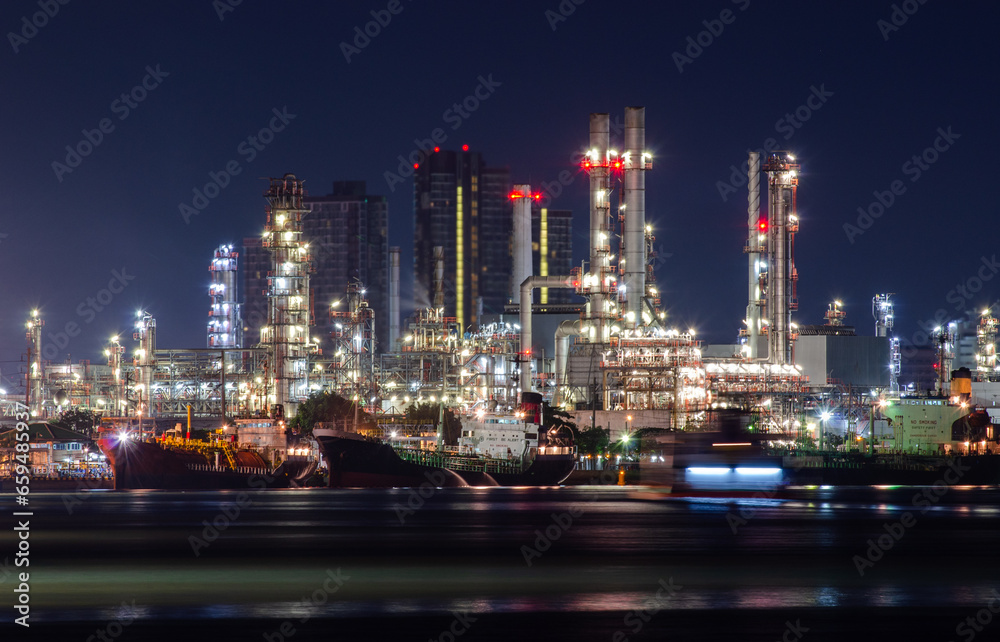 Obraz premium Industry Oil refinery oil and gas refinery background, Business petrochemical industrial, Refinery oil and gas factory power and fuel energy, Ecosystem estates. Fuel refinery industry at light
