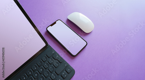 Laptop and smartphone. Blank screen mockup. Smart devices. Mouse. Computer equipment. Colorful background.