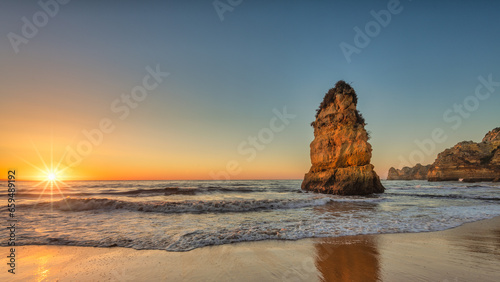 sunrise on the beach dona ana algarve portugal near lagos photo