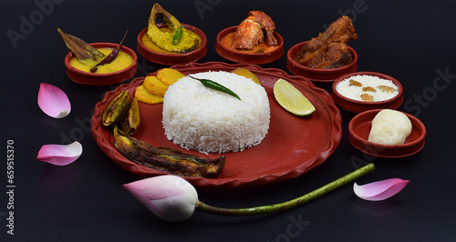 DECORATIVE DURGA PUJA BHOG THALI ISOLATED ON BLACK BACKGROUND. photo