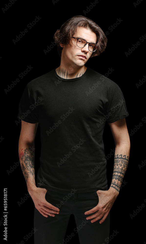 Man model with glasses wearing black blank t-shirt and black jeans Man model with glasses wearing black blank t-shirt and black jeans