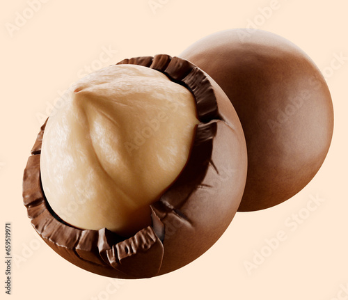 Heap of  hazelnuts dragees in chocolate isolated on white background.  chocolate balls candies filled with nuts. 3d illustration. 
