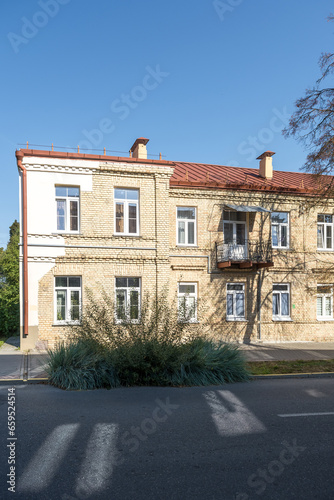 Fototapeta Naklejka Na Ścianę i Meble -  example of hundred-year-old historical building and homestead of private sector in city