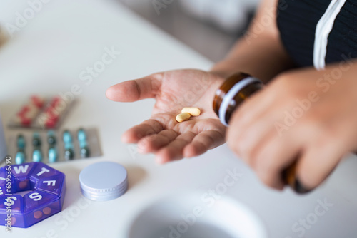 Close up woman holding pill in hand with water feeling sick. female going to take painkiller from headache  painkiller  healthcare  medicine  treatment  therapy  patient  disease illness concept