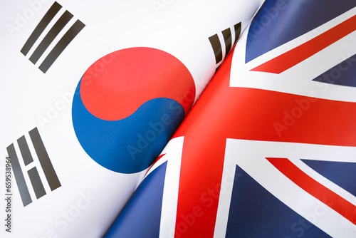 Background of flags of south korea and Great Britain. The concept of interaction or counteraction between two countries. International relations. political negotiations. Sports competition.