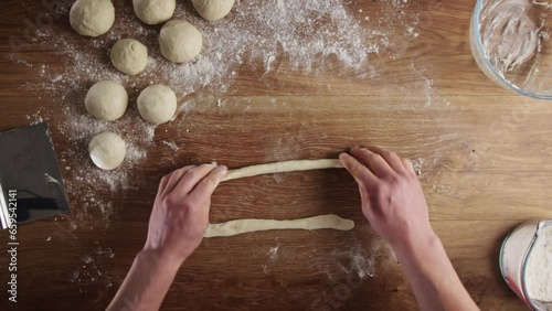 Home baking - making fresh Greek bagels or koulouri of Thessaloniki.