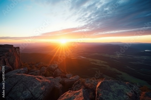 view from a mountain peak at sunrise