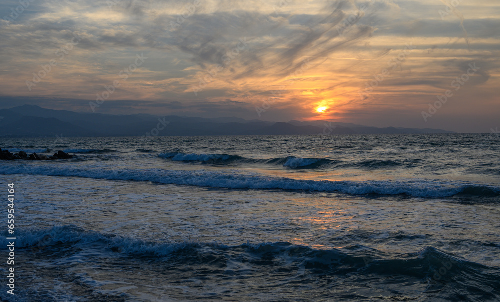 shore of the Mediterranean sea autumn 2023 in the setting sun 4