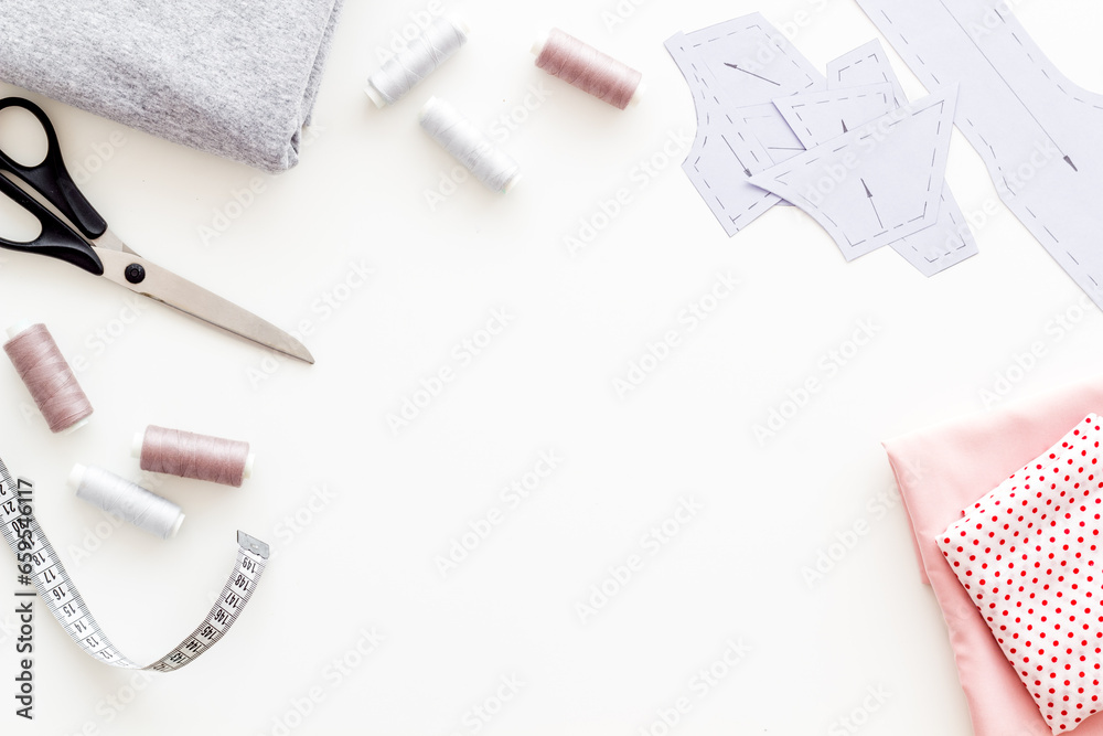 Fototapeta premium Sewing patterns on tailor or dressmaker table, sewing dress workshop concept