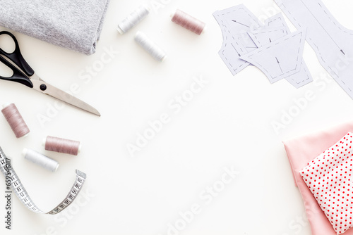 Sewing patterns on tailor or dressmaker table, sewing dress workshop concept