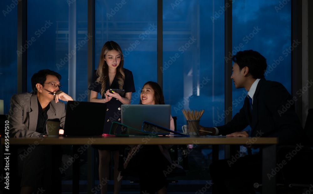 Group of business people working in office at night. Business concept. Group of business people working in office at night. Business concept.