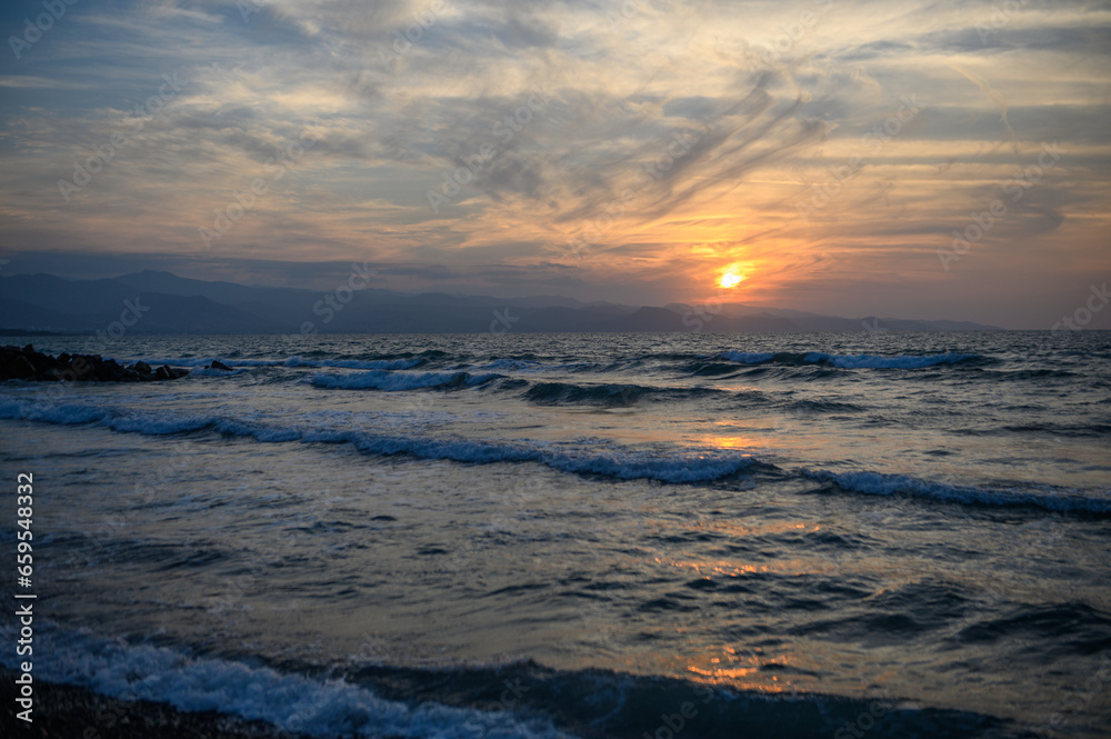 shore of the Mediterranean sea autumn 2023 in the setting sun 1