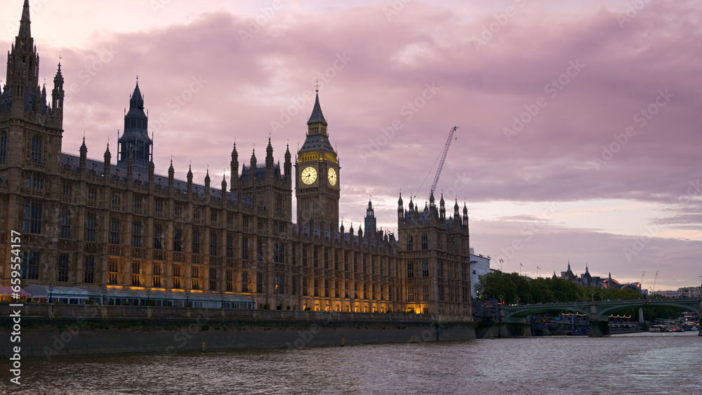 View of Westminster from a floating boat in London at sunset, United Kingdom