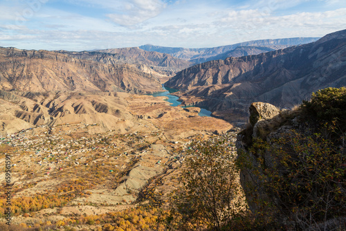 Mountainous landscape with a valley, river in autumn from Gunib fortress, Dagestan, Russia photo