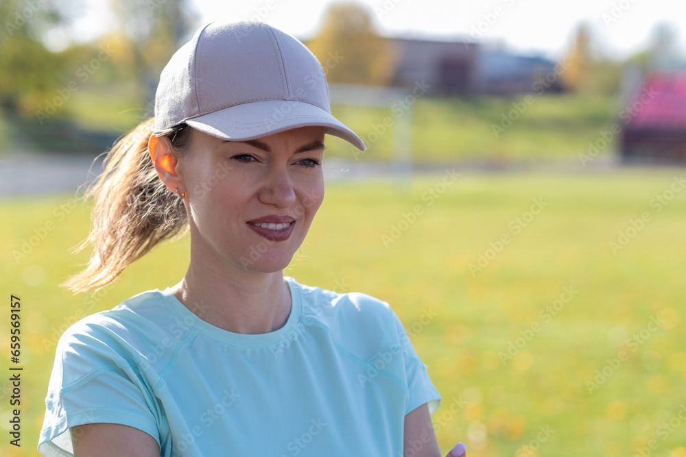 A young beautiful woman in sportswear plays sports at a local stadium. Exercise, jog and exercise at the beginning of the day. Healthy and active lifestyle. A young beautiful woman in sportswear plays sports at a local stadium. Exercise, jog and exercise at the beginning of the day. Healthy and active lifestyle.