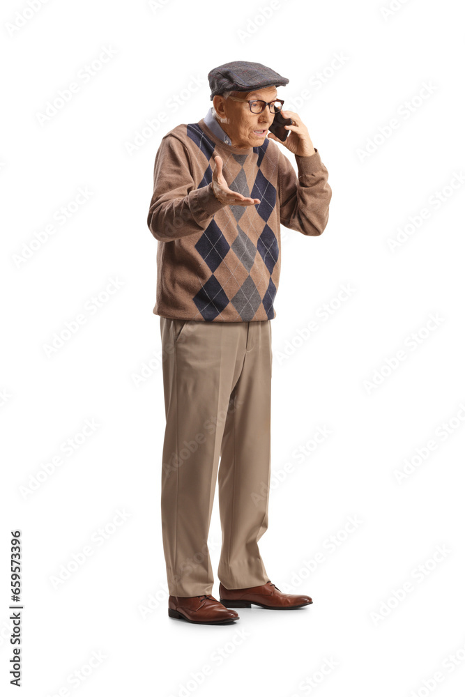 Full length shot of an angry elderly man making a phone call Full length shot of an angry elderly man making a phone call
