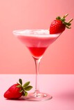Strawberry alcoholic cocktail on pink background.