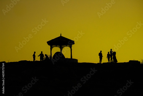 Silhouette image of the beautiful arch during sunrise and golden sky or blue sky in the background in Gandikota Grand Canyon of India tourism place located at Kadapa, Andhra pradesh photo