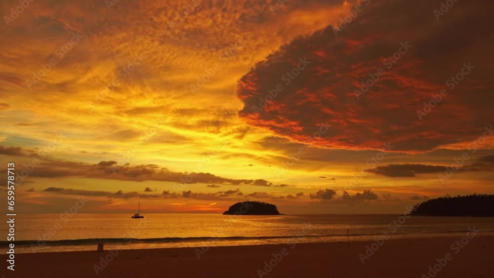 .scenery golden sunset above the ocean yellow clouds cover the ocean..large cloud in beautiful sunset at Kata beach Phuket Thailand. .video 4K. Scene of sweet yellow light in the sky background.. .scenery golden sunset above the ocean yellow clouds cover the ocean..large cloud in beautiful sunset at Kata beach Phuket Thailand. .video 4K. Scene of sweet yellow light in the sky background..