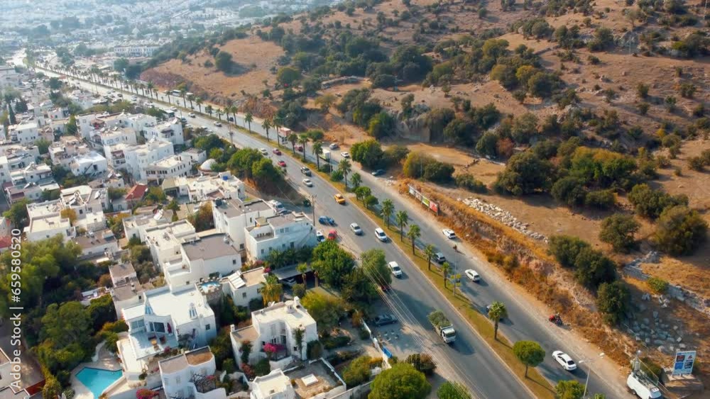 Aerial view of major tourist city of Bodrum in Turkey from drone, mountain and valley view.