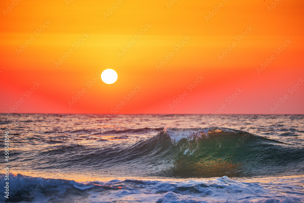 Beautiful green sunrise wave and cloudscape over the sea, sunrise shot