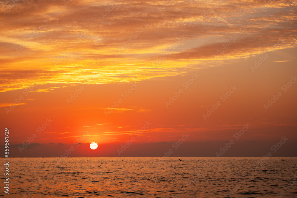 Beautiful sunrise over the sea water surface